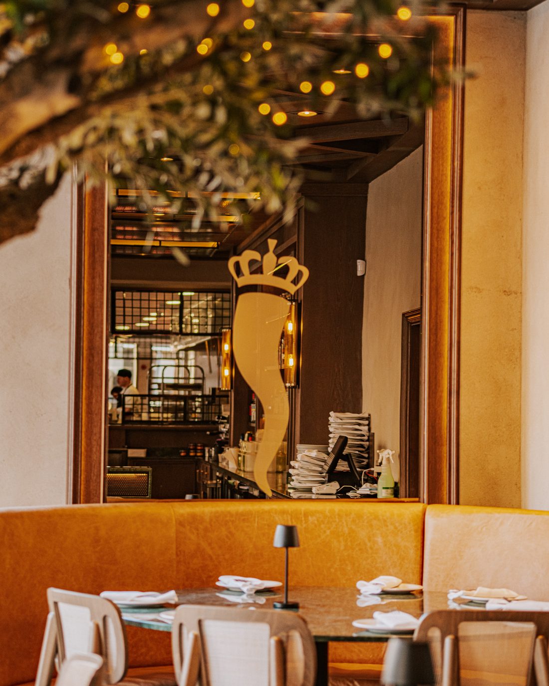 The brass corno on the dining room wall at Malocchio